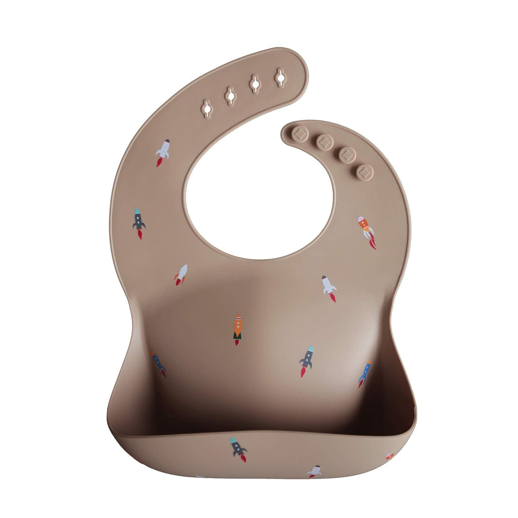 mushie Silicone Baby Bib | Adjustable Fit Waterproof Bibs (Rocket Ship)