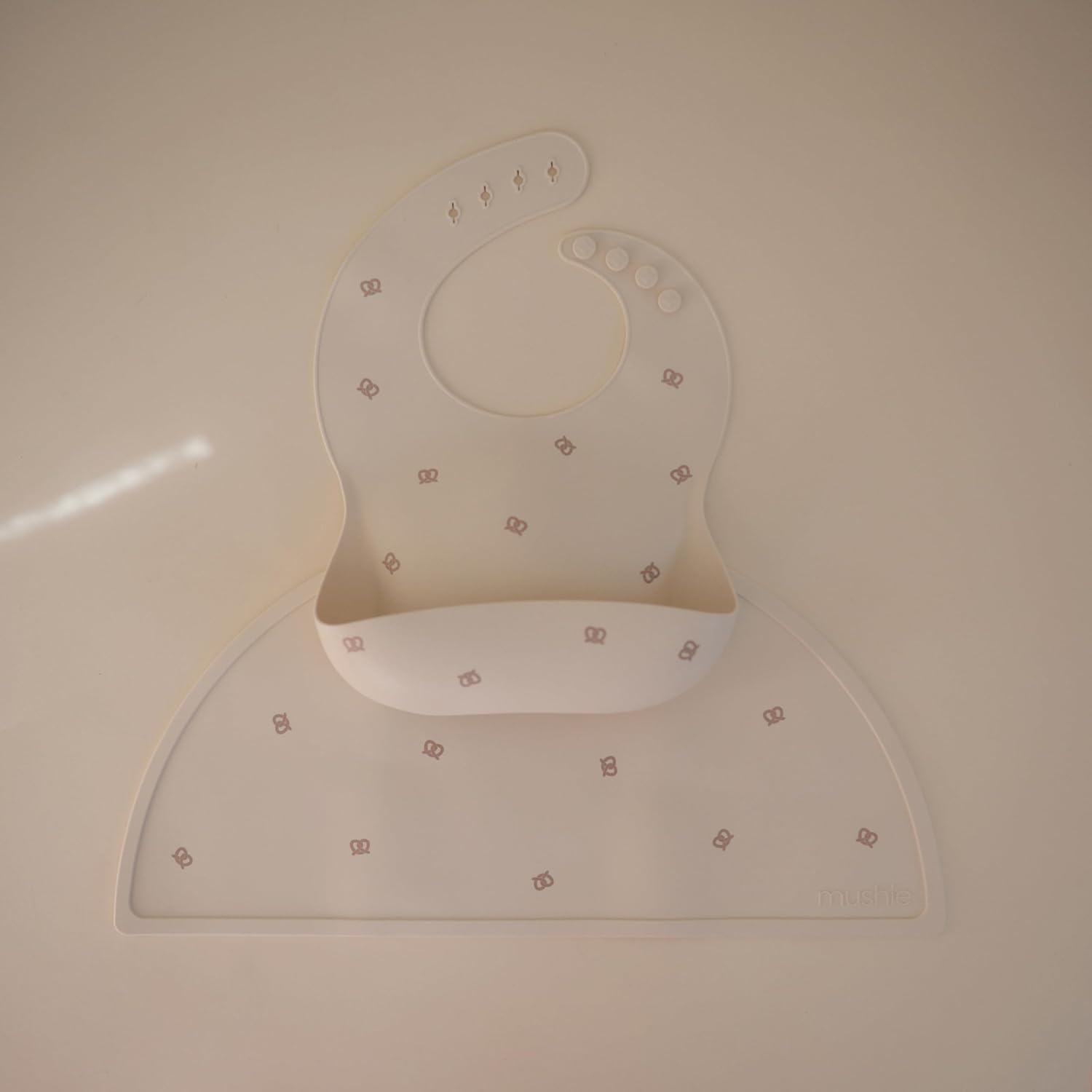 mushie Silicone Baby Bib | Adjustable Fit Waterproof Bibs (Pretzel)