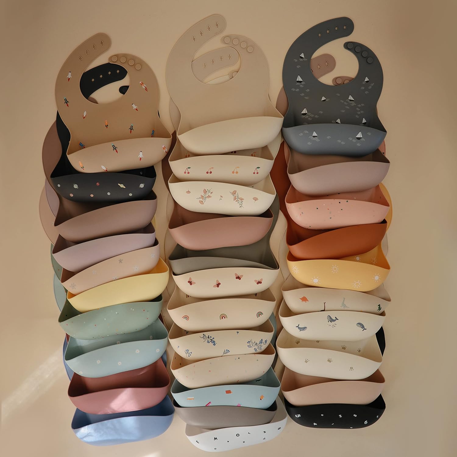 mushie Silicone Baby Bib | Adjustable Fit Waterproof Bibs (Black Daisy)