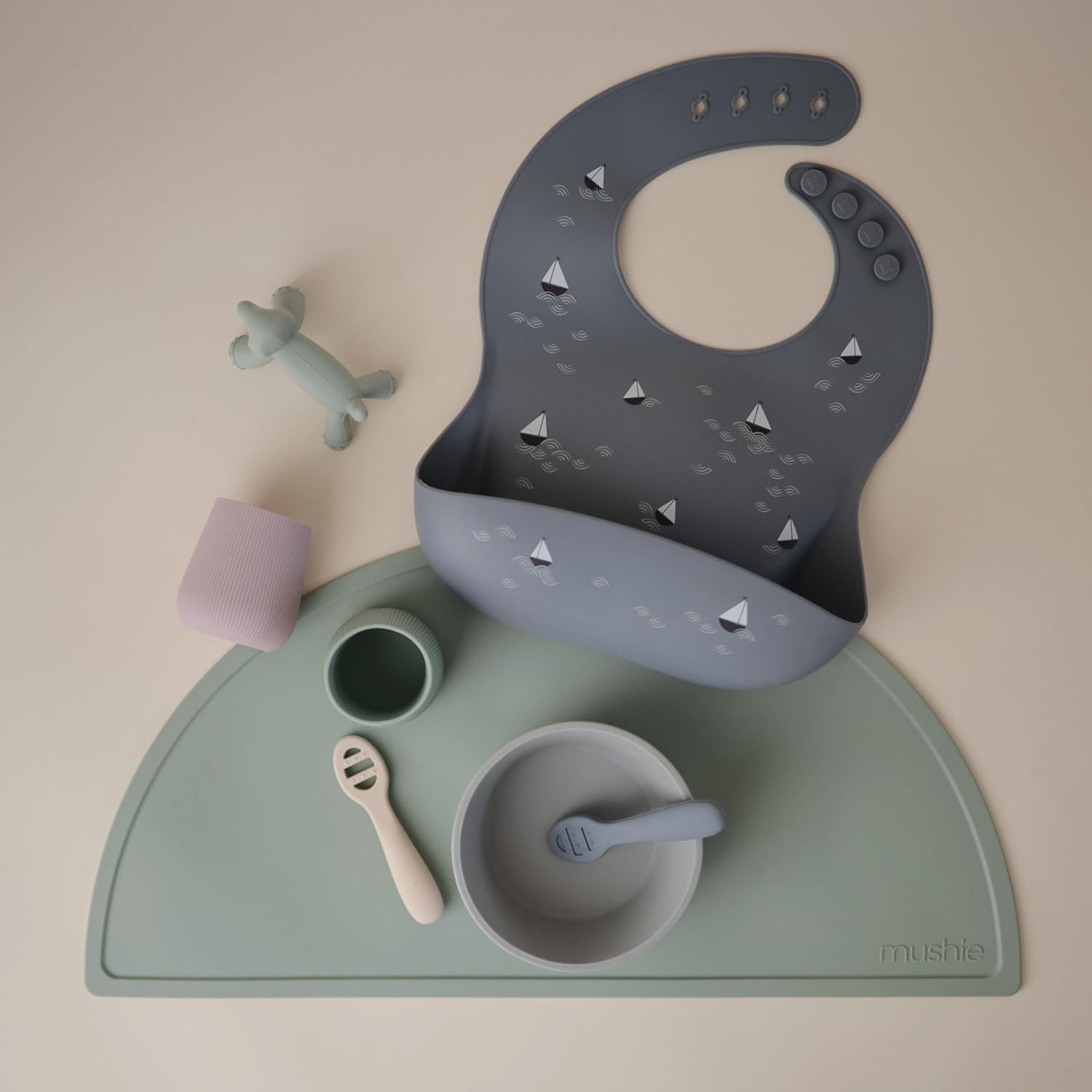 mushie Silicone Baby Bib | Adjustable Fit Waterproof Bibs (Boats)