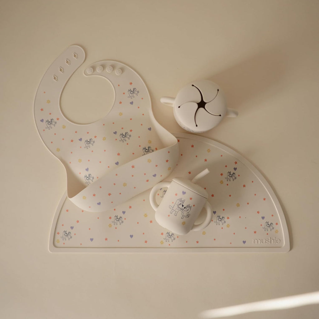 mushie x Bluey Silicone Baby Bib | Adjustable Fit Waterproof Bibs (Bluey Ivory)