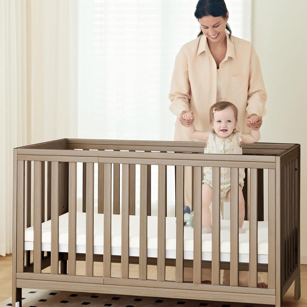 EvoNest Baby Crib, 11 in 1 Convertible Mini Crib with Wheels, 100% New Zealand Wood Growing Bed, 4 Adjustable Mattress Height ，Walnut Brown