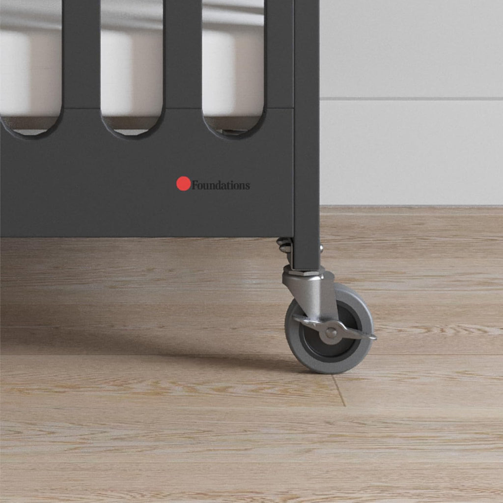 Foundations Boutique Folding Mini Baby Crib - Compact, Portable, Wooden Hotel Crib, Foldable Compact Cribs for Baby & Toddlers - Includes 3" Foam Mattress - Ebony