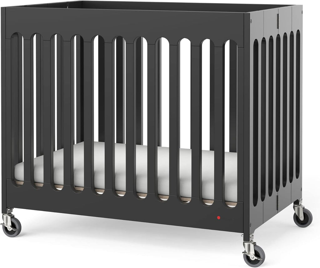 Foundations Boutique Folding Mini Baby Crib - Compact, Portable, Wooden Hotel Crib, Foldable Compact Cribs for Baby & Toddlers - Includes 3" Foam Mattress - Ebony