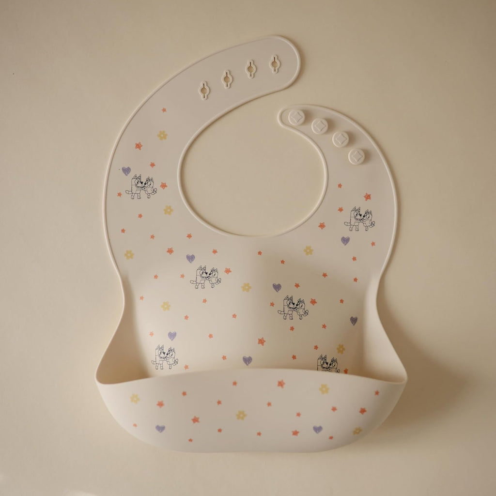 mushie x Bluey Silicone Baby Bib | Adjustable Fit Waterproof Bibs (Bluey Ivory)