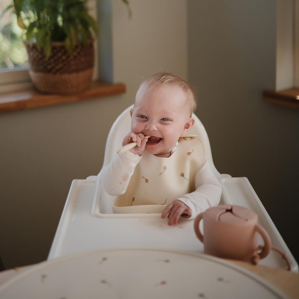 mushie Silicone Baby Bib | Adjustable Fit Waterproof Bibs (Kites)