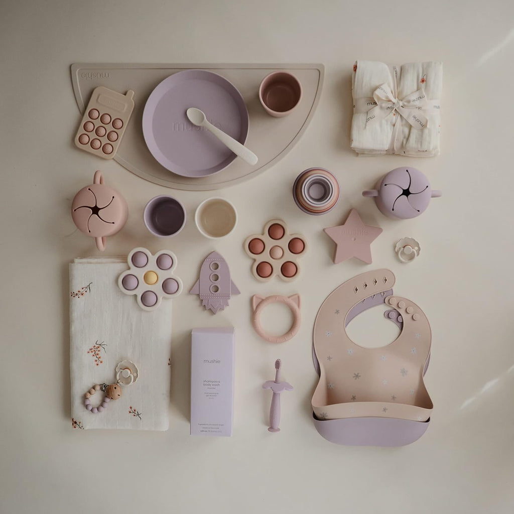 mushie Silicone Baby Bib | Adjustable Fit Waterproof Bibs (Daisy)