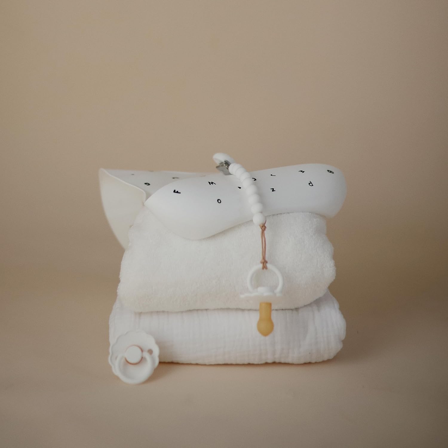 mushie Silicone Baby Bib | Adjustable Fit Waterproof Bibs (Letters White)