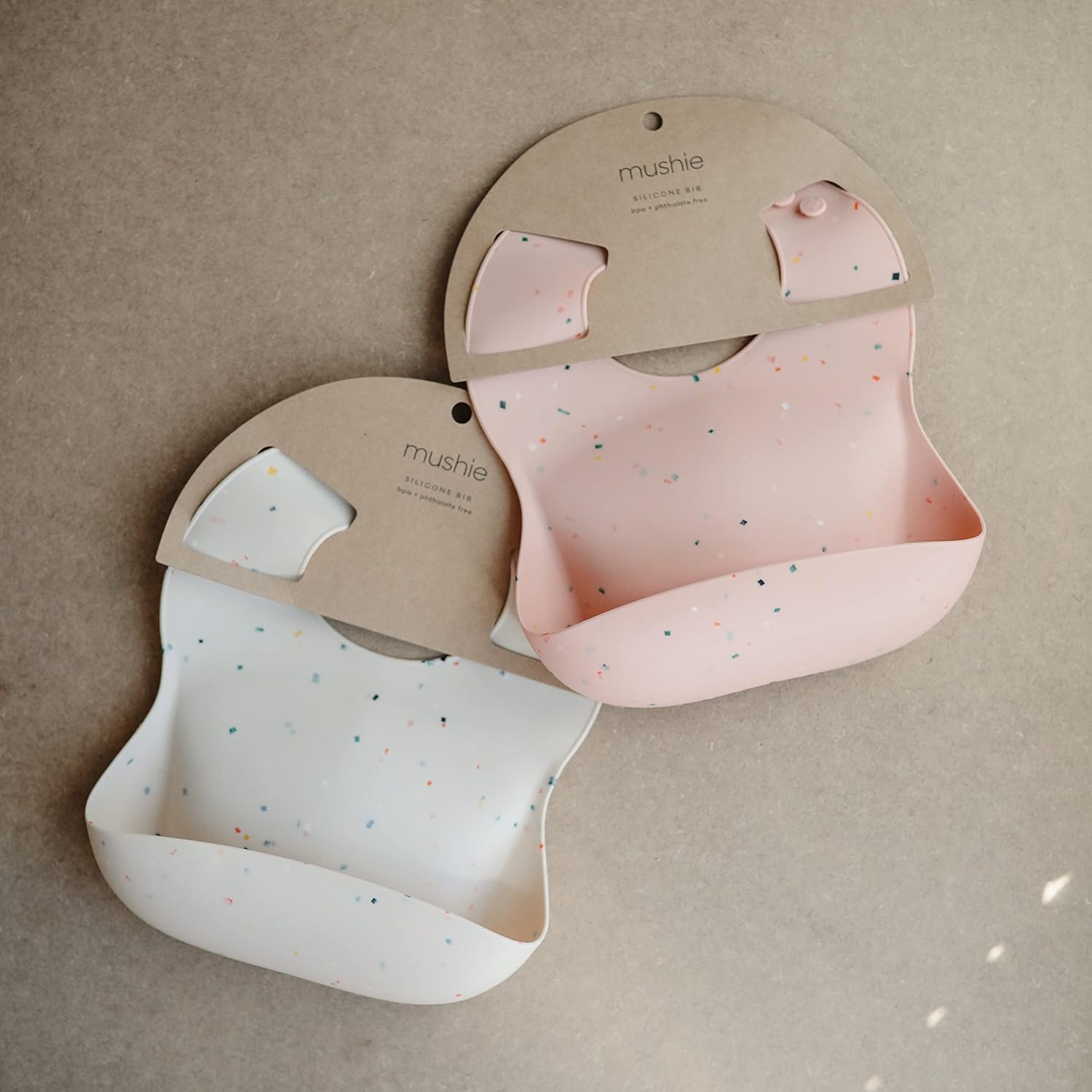 mushie Silicone Baby Bib | Adjustable Fit Waterproof Bibs (Powder Pink Confetti)