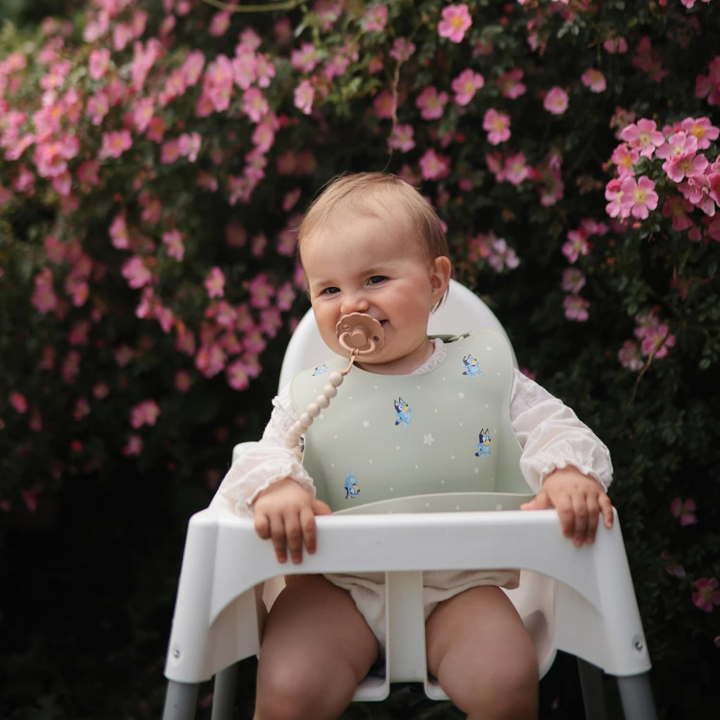 mushie x Bluey Silicone Baby Bib | Adjustable Fit Waterproof Bibs (Bluey Ivory)